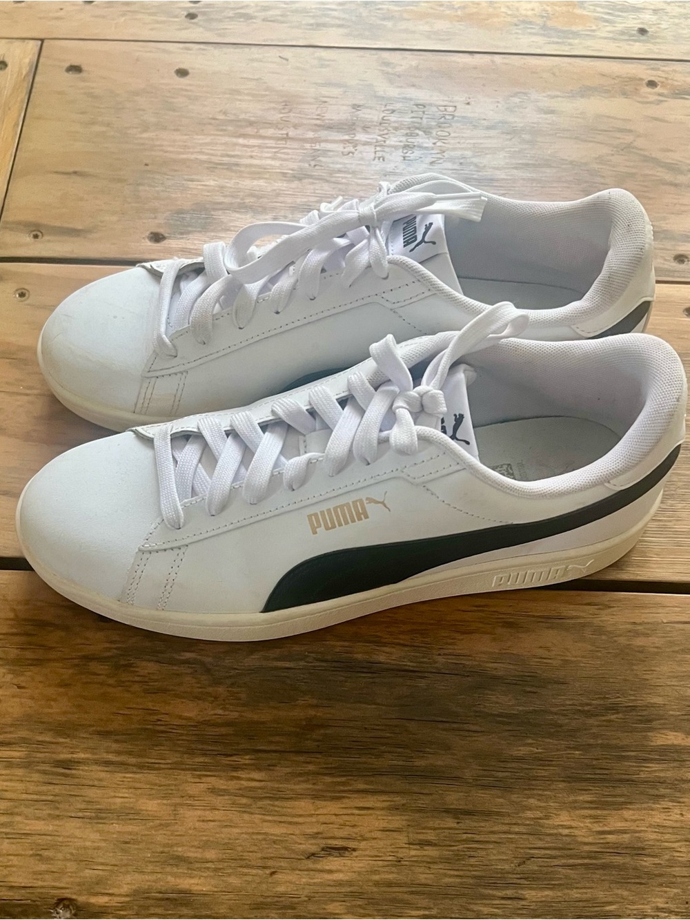 Men’s Puma White Sneakers with Black Stripe and Gold Logo
